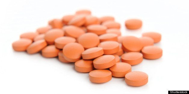 orange pills. isolated on a...