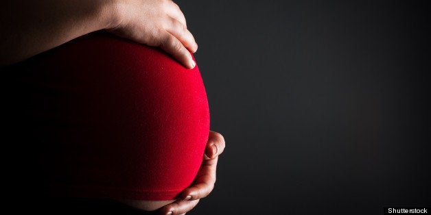 Stomach of the pregnant woman, close up