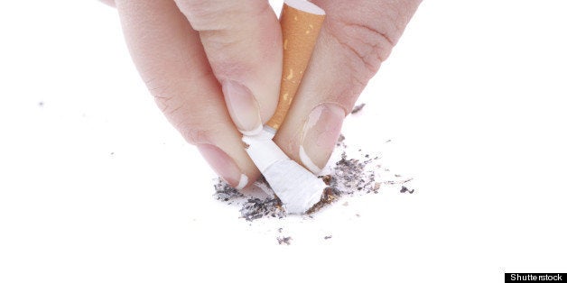 woman hand stub out a cigarette