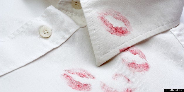 close up of white shirt and red lipstick on it