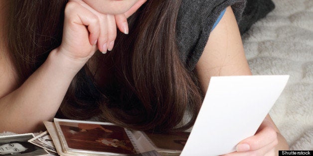 Young women looking through old photographs