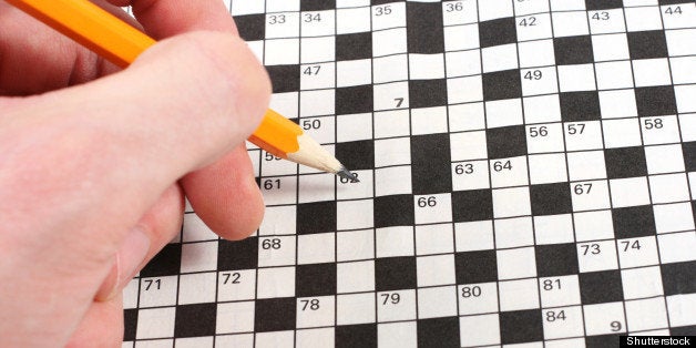 hand doing crossword