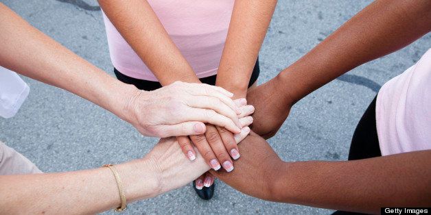 Women with Hands Together in a Circle