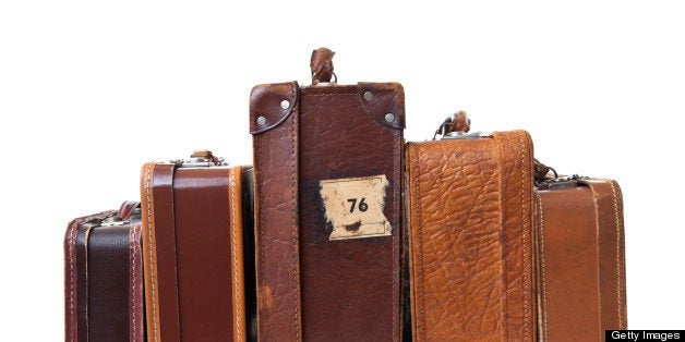 Vintage suitcases in a heap.