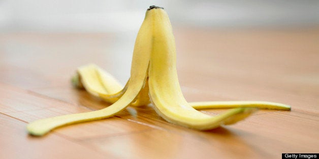 Banana peel on wooden floor