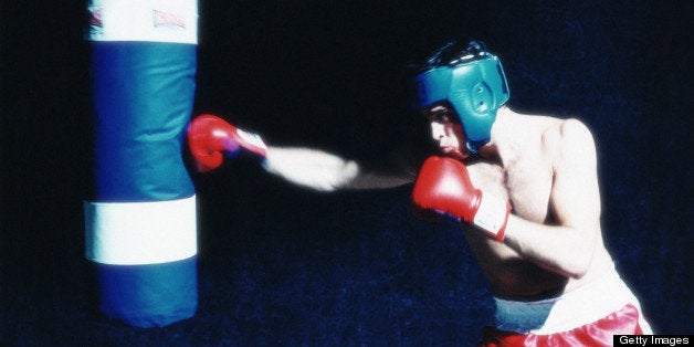 Boxer hitting punching bag