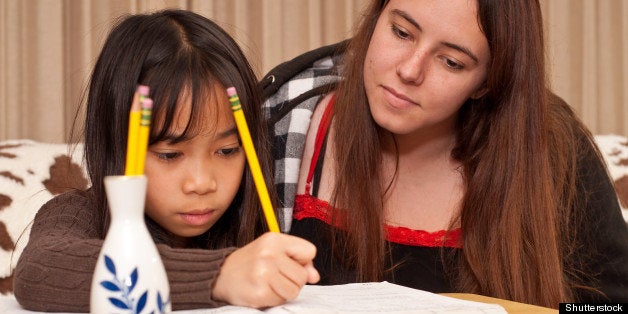 Tutor and Her Student Doing Homework