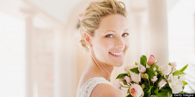 Smiling bride with bouquet