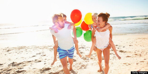 Family playing on beach