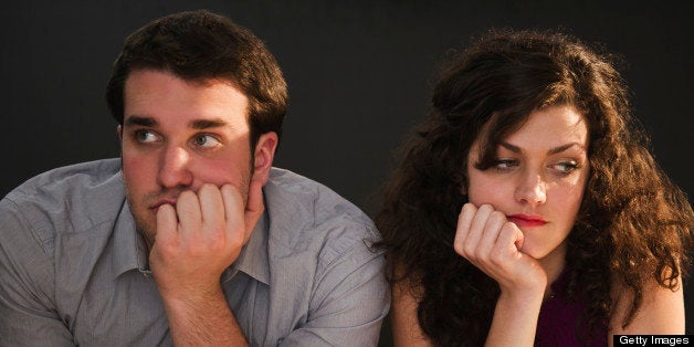 USA, New Jersey, Jersey City, Bored couple sitting at bar counter