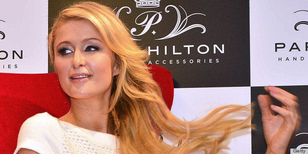 US socialite Paris Hilton attends a press conference at the Hilton Hotel in Bogota, on April 24, 2103. Hilton is in Colombia to launch her collection of bags. AFP PHOTO/Luis Acosta (Photo credit should read LUIS ACOSTA/AFP/Getty Images)