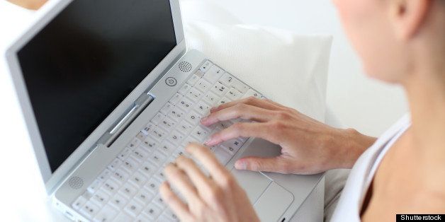 closeup of woman using laptop...