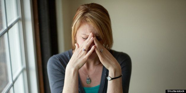 Woman with stress headache problem