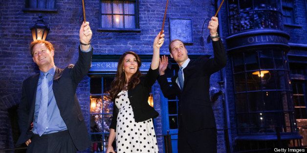 LONDON, ENGLAND - APRIL 26: Prince Harry, Catherine, Duchess of Cambridge and Prince William, Duke of Cambridge raise their wands on the set used to depict Diagon Alley in the Harry Potter Films during the Inauguration Of Warner Bros. Studios Leavesden on April 26, 2013 in London, England. (Photo by Paul Rogers - WPA Pool/Getty Images)