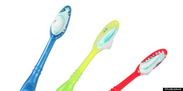 toothbrushes in glass isolated...