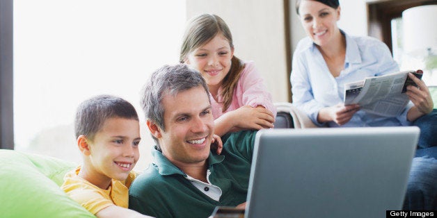 Family using laptop together