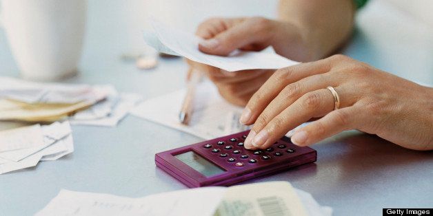 Woman Using a Calculator