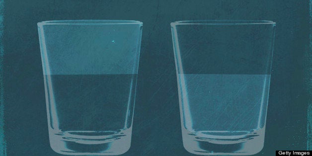 A half full glass of water next to a half empty glass of water