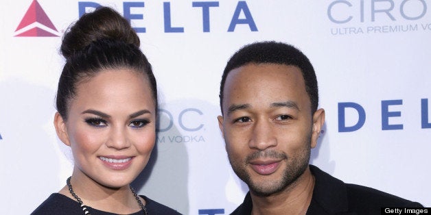 NEW YORK, NY - MAY 01: Chrissy Teigen, and John Legend attend as Delta Air Lines celebrate the opening night of T4X, a pop up experience showcasing distinctive features of the airline?s newly transformed international hub at JFK?s Terminal 4 on May 1, 2013 in New York City. (Photo by Anna Webber/Getty Images for Delta)