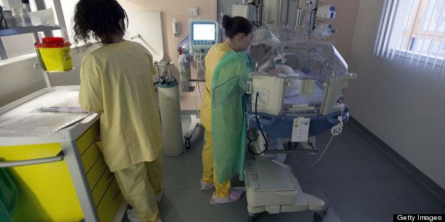 Nurses attend to a premature newborn in the neo-natal ward of the Delafontaine hospital in Saint Denis near Paris on March 19, 2013. AFP PHOTO / JOEL SAGET (Photo credit should read JOEL SAGET/AFP/Getty Images)