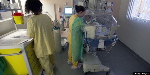 Nurses attend to a premature newborn in the neo-natal ward of the Delafontaine hospital in Saint Denis near Paris on March 19, 2013. AFP PHOTO / JOEL SAGET (Photo credit should read JOEL SAGET/AFP/Getty Images)