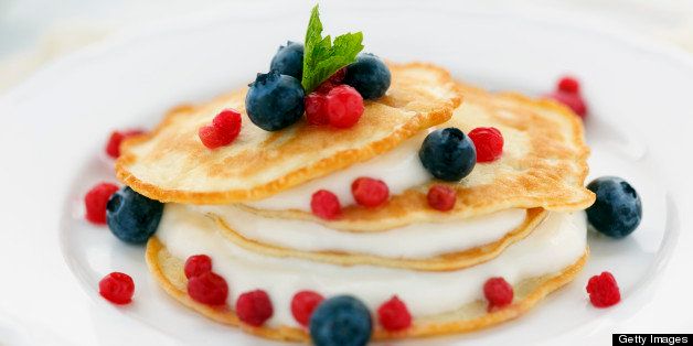 Crepes made from coconut products and eggs. Gluten, grain and wheat free. Topped with blueberries, huckleberries and filled with vanilla greek yogurt.