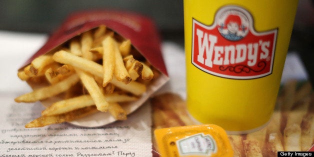 A customer's meal of French fries and a soft drink sit on a tray inside a Wendy's fast food restaurant in Moscow, Russia, on Friday, April 5, 2013. McDonald's, which virtually created the market for burgers and fries in the country and convinced Russians it's OK to eat with their hands, must fend off a growing challenge from rivals Burger King Worldwide Inc., Subway Restaurants, Yum! Brands Inc. and Wendy's Co. Photographer: Andrey Rudakov/Bloomberg via Getty Images