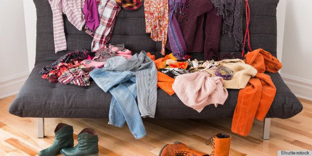 What to wear? Messy colorful clothing on a sofa.