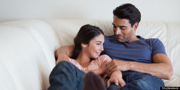 portrait of a couple lying on a ...