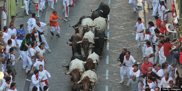 Waiters running bulls in Santo Domingo during San Fermin festivities,Spain.