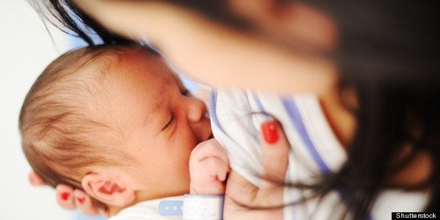 mother breastfeeding her newborn