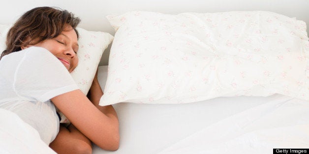 Black woman sleeping in bed