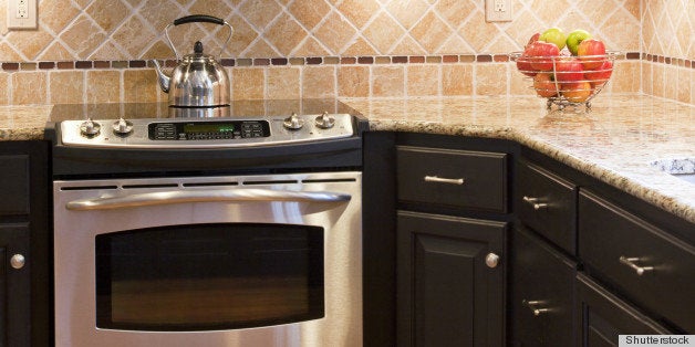 modern kitchen with dark brown...