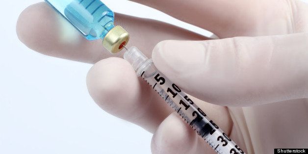close up of syringe with vial...