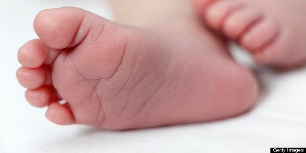 Close up of newborn little foot