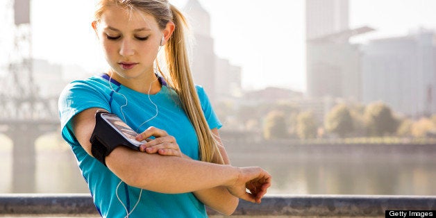 A female listening to music and jogging in Portland, Oregon.