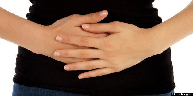 Pain in the abdomen on white background