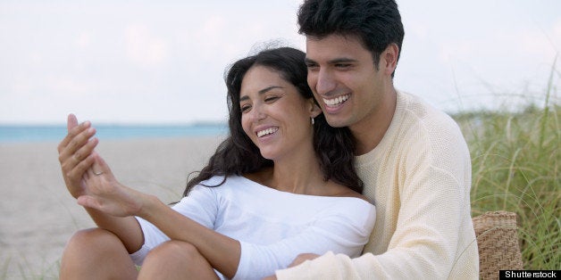 couple hugging on the beach