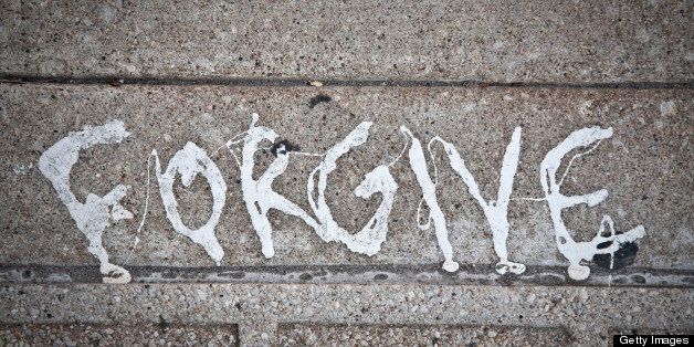 FORGIVE WRITTEN IN PAINT ON PAVEMENT/SIDEWALK