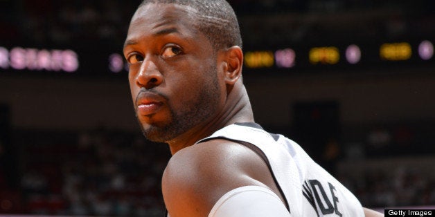 MIAMI, FL - APRIL 23: Dwyane Wade #3 of the Miami Heat stands on the court during the match-up against the Milwaukee Bucks in Game Two of the Eastern Conference Quarterfinals during the 2013 NBA Playoffs on April 23, 2013 at American Airlines Arena in Miami, Florida. NOTE TO USER: User expressly acknowledges and agrees that, by downloading and or using this photograph, User is consenting to the terms and conditions of the Getty Images License Agreement. Mandatory Copyright Notice: Copyright 2013 NBAE (Photo by Jesse D. Garrabrant/NBAE via Getty Images)