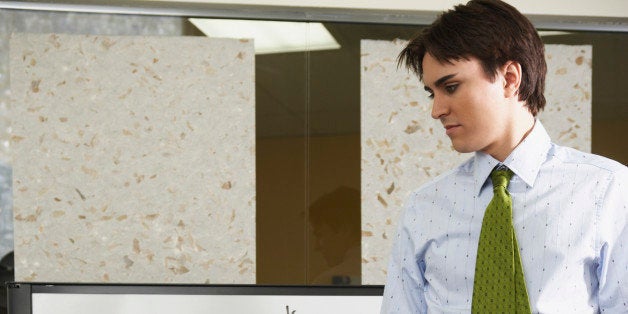 Young man standing in front of whiteboard