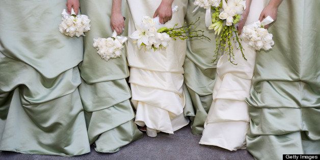 Bridesmaids holding bouquets.