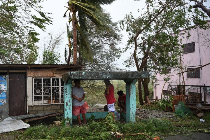 Residents take shelter as they wait for the government's help in the aftermath of super Typhoon Mangkhut in Tuguegarao on September 15