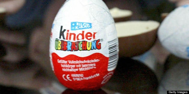 FILES - A picture dated November 25, 2002 in Frankfurt/Main shows a boy with a 'Kinder Surprise' chocolate egg. Despite being a massive hit with children and adults alike, German lawmakers want to ban Kinder surprise eggs on safety grounds, press reports said on August 7, 2008. AFP PHOTO DDP/MARTIN OESER GERMANY OUT (Photo credit should read MARTIN OESER/AFP/Getty Images)