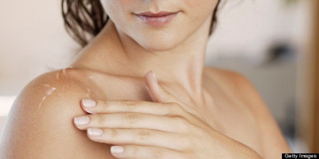 Woman Applying Beauty Cream