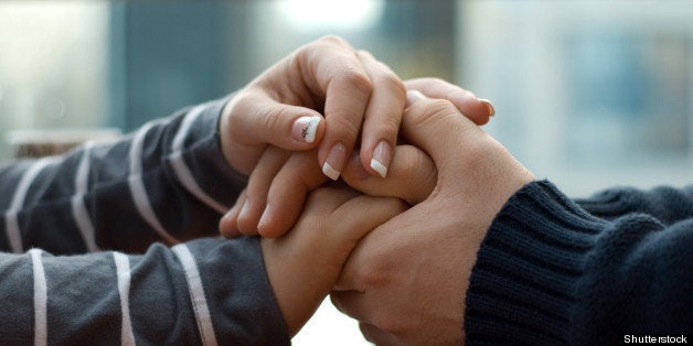 Man and woman holding each other hands