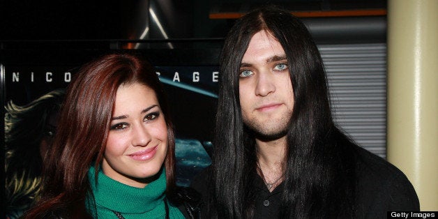 HOLLYWOOD, CA - FEBRUARY 22: Musician Weston Cage (R) and Nikki Williams attend a screening of Summit Entertainment's 'Drive Angry 3D' at ArcLight Cinemas on February 22, 2011 in Hollywood, California. (Photo by David Livingston/Getty Images)