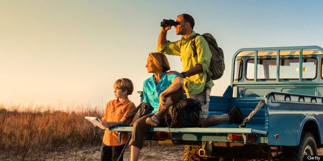 A family taking a break after backpacking.