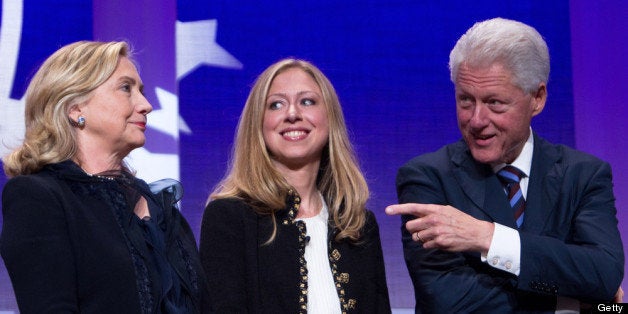 NEW YORK CITY- SEPTEMBER 22: Former US President Bill Clinton (R) stands on stage with his wife Hillary Rodham Clinton (L), Secretary of State, and their daughter Chelsea Clinton during the closing Plenary session of the seventh Annual Meeting of the Clinton Global Initiative (CGI) at the Sheraton New York Hotel on September 22, 2011 in New York City. Established in 2005 by former U.S. President Bill Clinton, the CGI assembles global leaders to develop and implement solutions to some of the world's most urgent problems. (Photo by Daniel Berehulak/Getty Images)