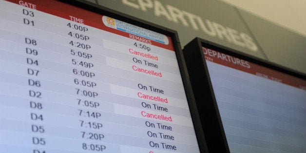 A departures screen displays cancelled flights at Fort Lauderdale-Hollywood International Airport in Fort Lauderdale, Florida on Monday, January 10, 2011. A winter storm in the southeast has caused flight cancellations and delays. (Carey Wagner/Sun Sentinel/MCT via Getty Images)